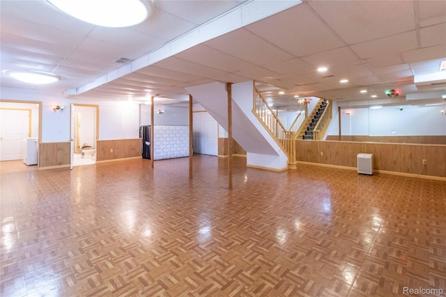 2864 Mystic Dr, Ann Arbor, MI 48103 - finished basement featuring wood walls, a wainscoted wall, a drop ceiling, and stairway