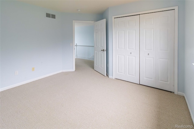 2864 Mystic Dr, Ann Arbor, MI 48103 - unfurnished bedroom with light carpet, a closet, and baseboards