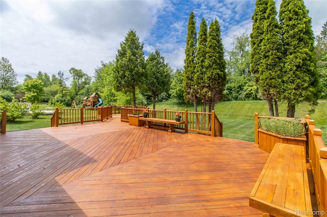2864 Mystic Dr, Ann Arbor, MI 48103 - wooden terrace with a lawn, a playground, and view of wooded area