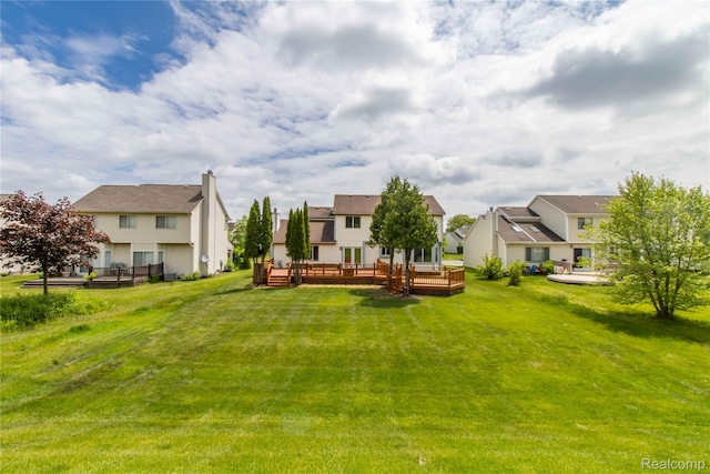 2864 Mystic Dr, Ann Arbor, MI 48103 - view of green lawn with a wooden deck and a residential view