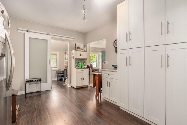 510 Cedar St, Paw Paw, MI 49079 - kitchen featuring stainless steel fridge, dark wood-style floors, and white cabinetry