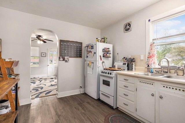 510 Cedar St, Paw Paw, MI 49079 - kitchen with white appliances, a sink, ceiling fan, dark wood-style floors, and healthy amount of natural light
