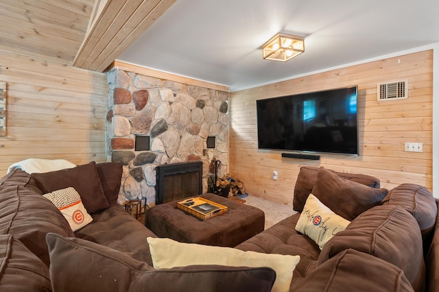 92282 Entrance Dr, Lawton, MI 49065 - carpeted living room with wood walls and a fireplace