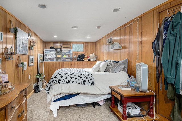 128 S Main St, Lawton, MI 49065 - carpeted bedroom with wood walls and recessed lighting