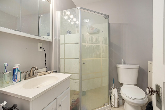128 S Main St, Lawton, MI 49065 - bathroom featuring a stall shower, vanity, and toilet