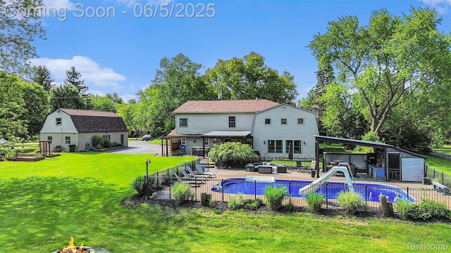 6080 Waldon Rd, Clarkston, MI 48346 - view of pool featuring an outdoor structure, a water slide, outdoor lounge area, view of scattered trees, and a patio area