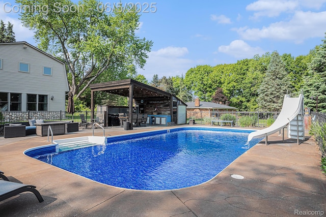 6080 Waldon Rd, Clarkston, MI 48346 - view of swimming pool featuring outdoor lounge area, a water slide, a patio, and a gazebo