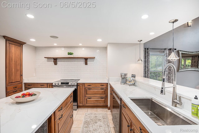 6080 Waldon Rd, Clarkston, MI 48346 - kitchen with a sink, appliances with stainless steel finishes, brown cabinetry, light stone counters, and recessed lighting
