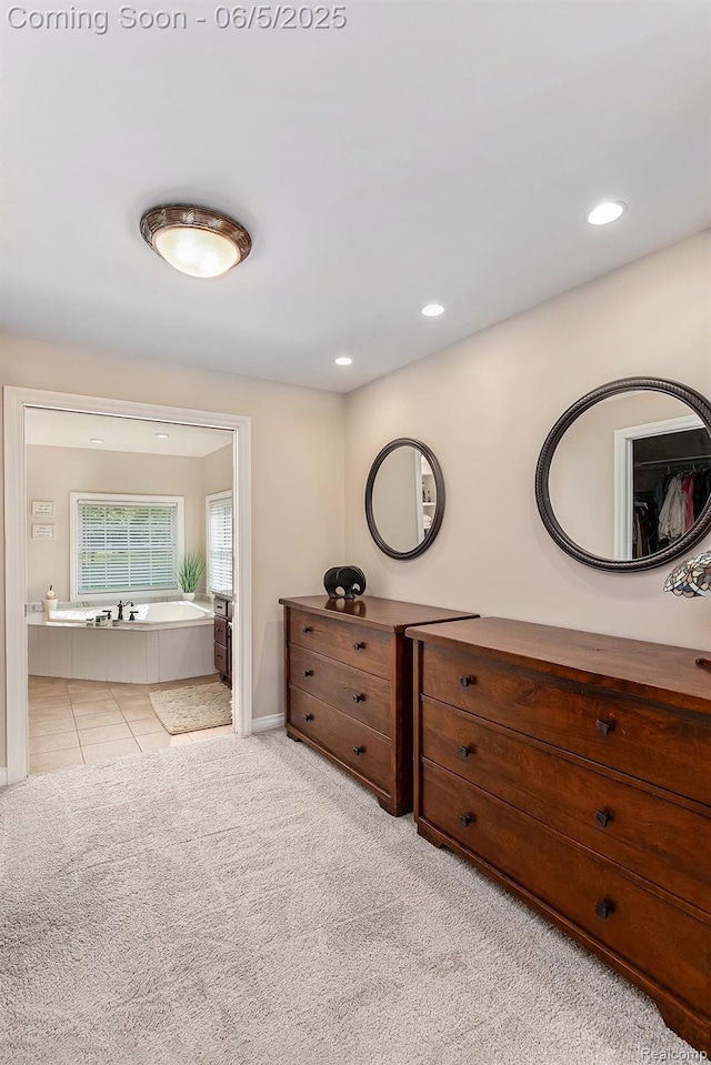 6080 Waldon Rd, Clarkston, MI 48346 - tiled bedroom featuring connected bathroom, recessed lighting, and baseboards