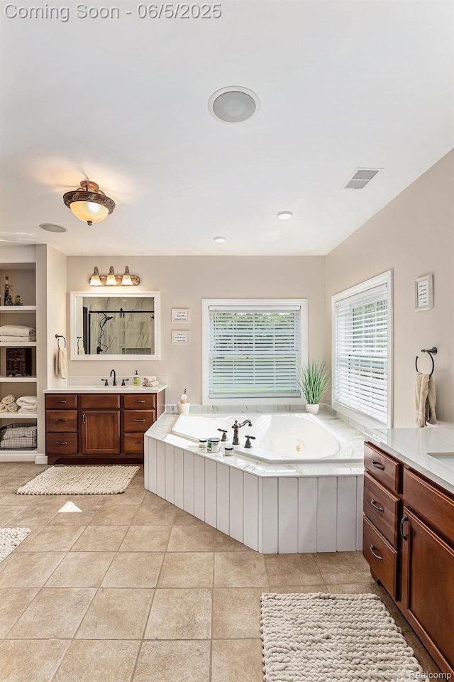 6080 Waldon Rd, Clarkston, MI 48346 - full bathroom featuring healthy amount of natural light, vanity, and a jetted tub