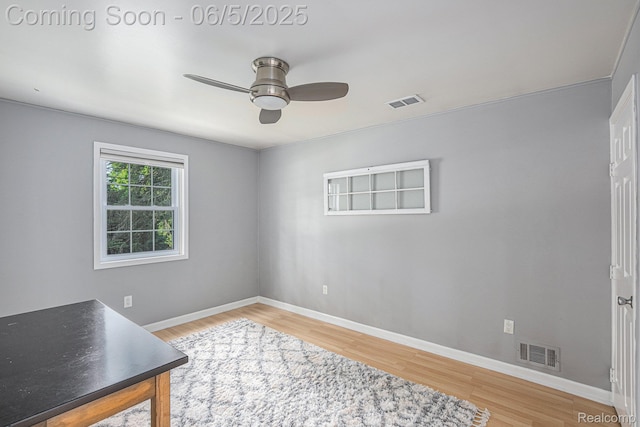 6080 Waldon Rd, Clarkston, MI 48346 - unfurnished room featuring ceiling fan, wood finished floors, and baseboards