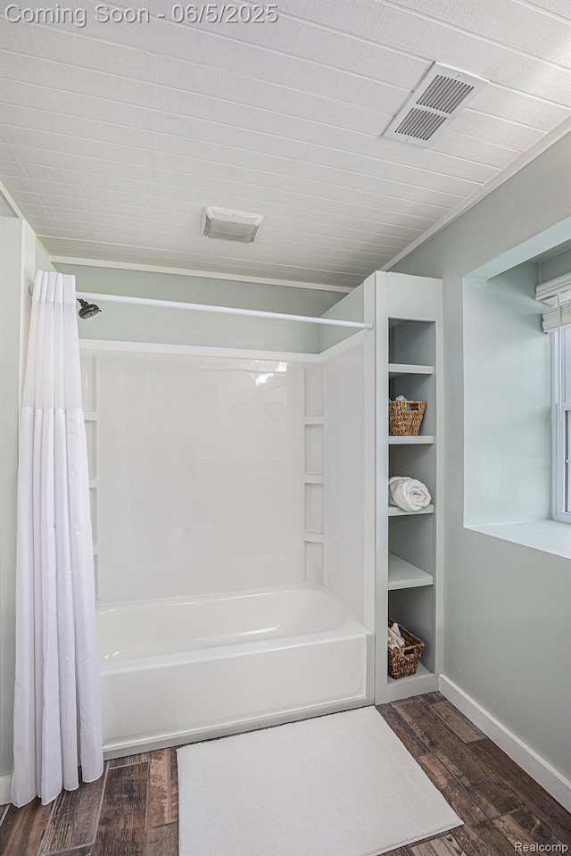 6080 Waldon Rd, Clarkston, MI 48346 - full bath featuring shower / bath combo with shower curtain, wood finished floors, and baseboards