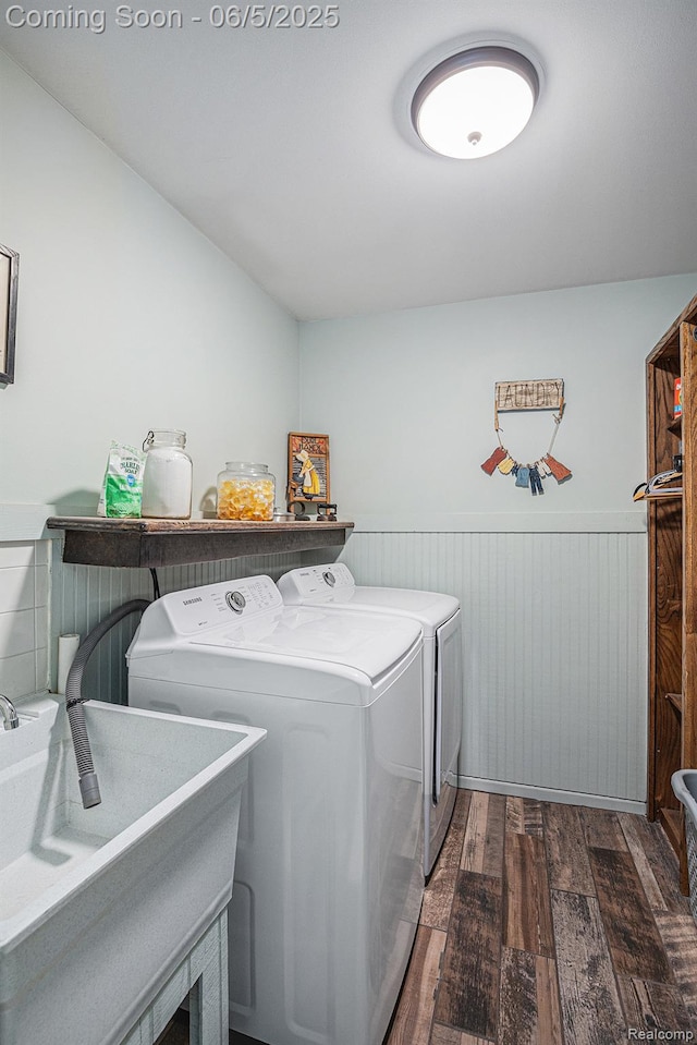 6080 Waldon Rd, Clarkston, MI 48346 - washroom featuring washing machine and dryer, dark wood-style floors, and a wainscoted wall