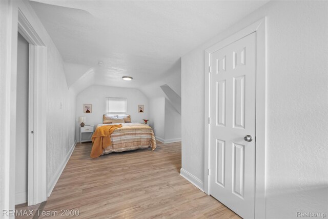 5935 Devonshire Rd, Dearborn, MI 48224 - bedroom featuring light wood-type flooring, baseboards, and vaulted ceiling