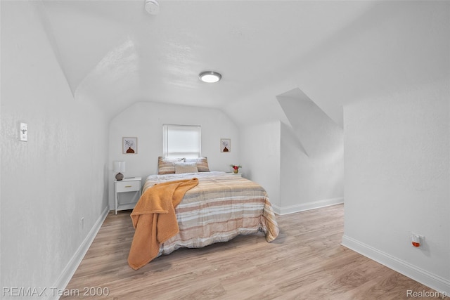 5935 Devonshire Rd, Dearborn, MI 48224 - bedroom featuring vaulted ceiling, baseboards, and light wood-type flooring