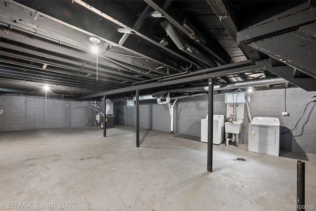 5935 Devonshire Rd, Dearborn, MI 48224 - unfinished basement with washer and clothes dryer, heating unit, and a sink