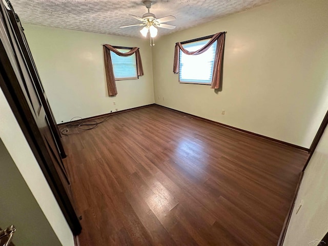 19379 Lincoln Rd, New Lothrop, MI 48460 - unfurnished room featuring a textured ceiling, ceiling fan, wood finished floors, and baseboards