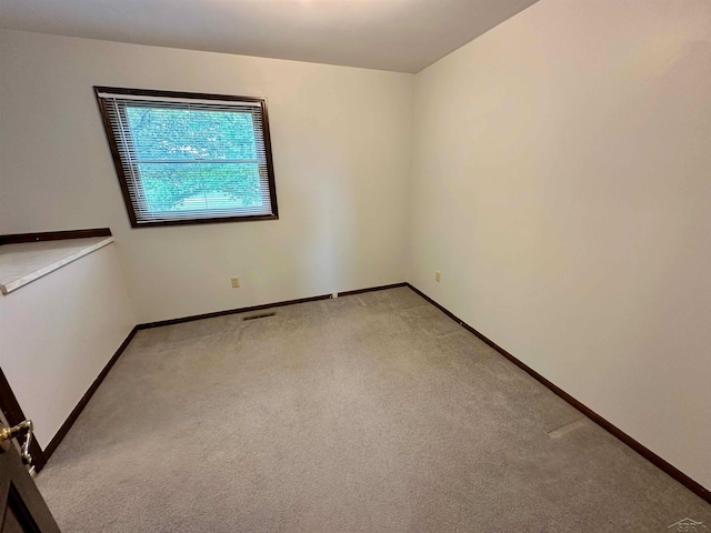 19379 Lincoln Rd, New Lothrop, MI 48460 - spare room featuring light colored carpet and baseboards
