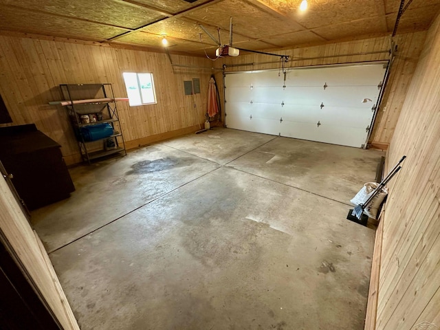 19379 Lincoln Rd, New Lothrop, MI 48460 - garage with wooden walls and a garage door opener