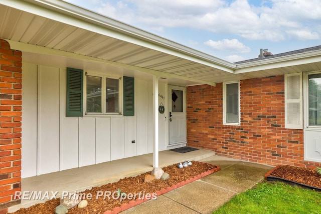 6461 Sheridan Rd, Saginaw, MI 48601 - doorway to property featuring brick siding and a porch