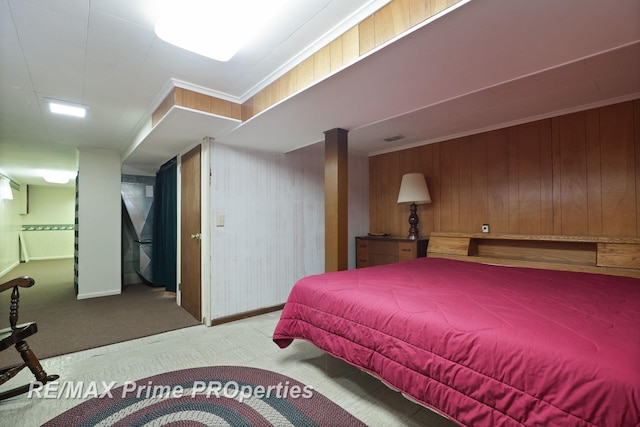 6461 Sheridan Rd, Saginaw, MI 48601 - carpeted bedroom with wood walls, crown molding, and baseboards