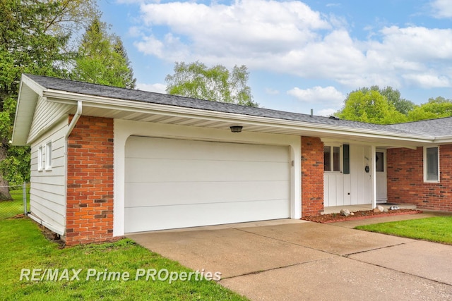 6461 Sheridan Rd, Saginaw, MI 48601 - view of front of house with brick siding, driveway, a garage, and a shingled roof