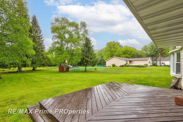 6461 Sheridan Rd, Saginaw, MI 48601 - wooden terrace with view of wooded area