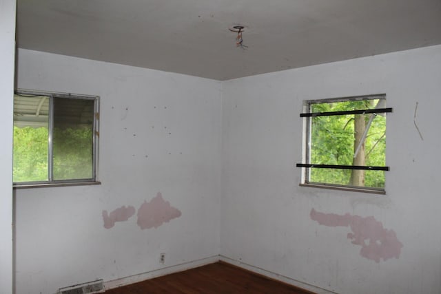 1609 Ohio Ave, Flint, MI 48506 - unfurnished room with plenty of natural light and dark wood-style flooring