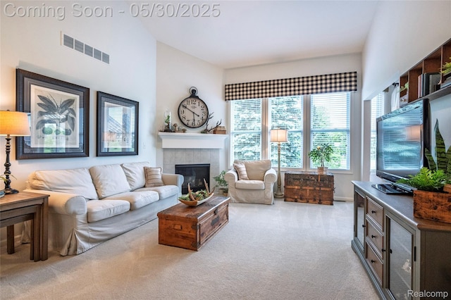 26727 Wilton Ct, New Hudson, MI 48165 - living area with light colored carpet and a tile fireplace