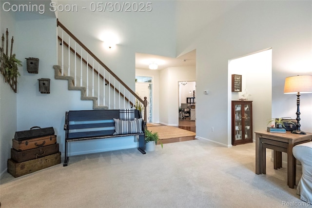 26727 Wilton Ct, New Hudson, MI 48165 - carpeted foyer with stairs, baseboards, and a high ceiling