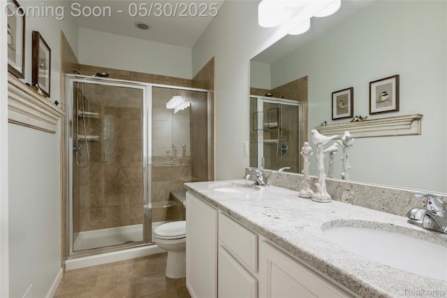 26727 Wilton Ct, New Hudson, MI 48165 - bathroom featuring toilet, tile patterned floors, a stall shower, and double vanity