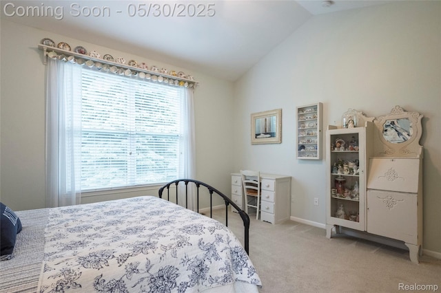 26727 Wilton Ct, New Hudson, MI 48165 - bedroom with lofted ceiling, light carpet, and baseboards