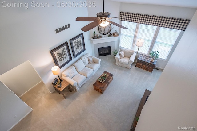 26727 Wilton Ct, New Hudson, MI 48165 - living room featuring a ceiling fan, carpet flooring, and a tile fireplace