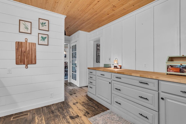 9410 US Highway 12, Brooklyn, MI 49230 - kitchen featuring butcher block countertops, wooden ceiling, dark wood-type flooring, french doors, and white cabinetry