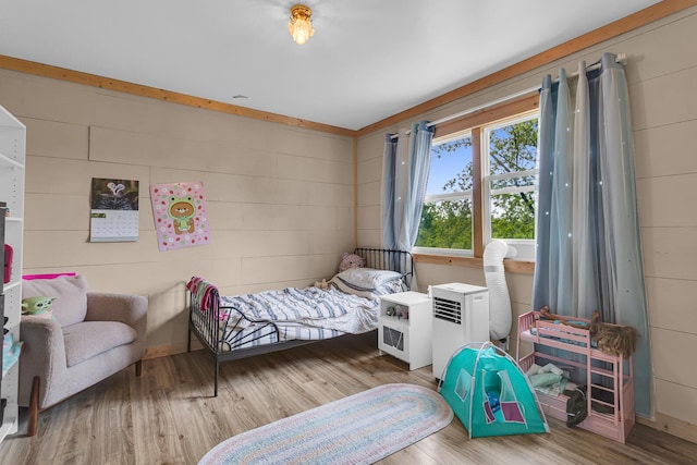 9410 US Highway 12, Brooklyn, MI 49230 - bedroom with wood finished floors and wooden walls
