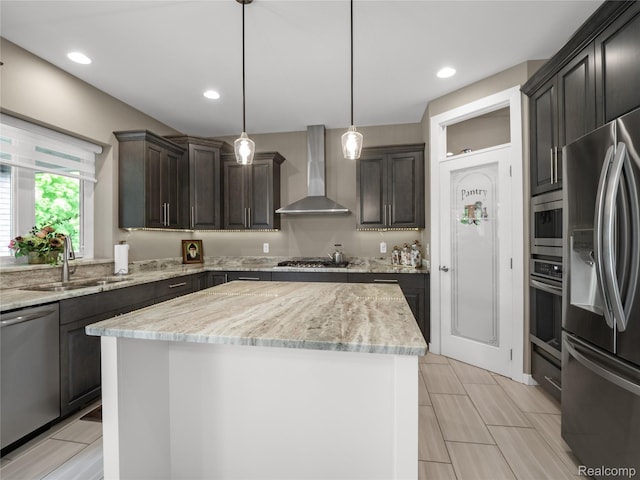 50011 Anita Way N, Macomb, MI 48044 - kitchen featuring wall chimney exhaust hood, appliances with stainless steel finishes, a sink, a center island, and light stone counters