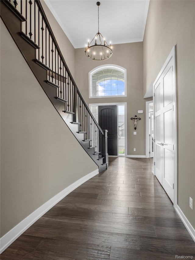 50011 Anita Way N, Macomb, MI 48044 - entryway with a chandelier, stairs, crown molding, dark wood-type flooring, and baseboards