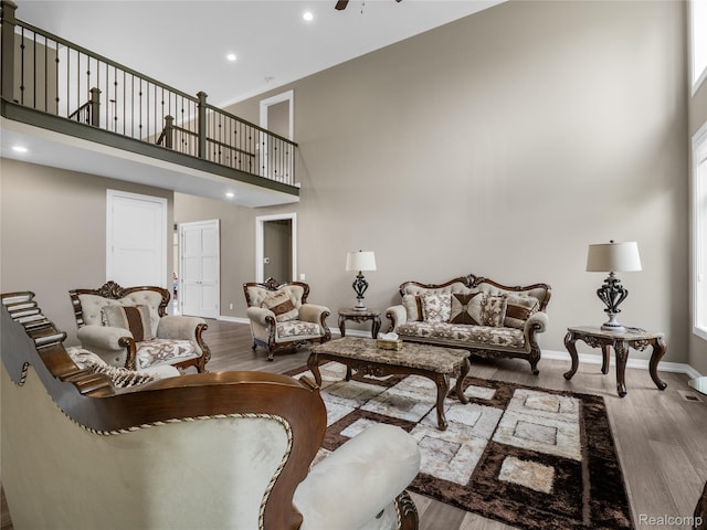 50011 Anita Way N, Macomb, MI 48044 - living area featuring a high ceiling, wood finished floors, recessed lighting, baseboards, and ceiling fan