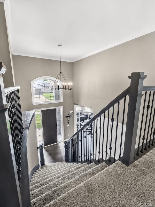 50011 Anita Way N, Macomb, MI 48044 - carpeted foyer featuring a chandelier, stairway, baseboards, and a towering ceiling