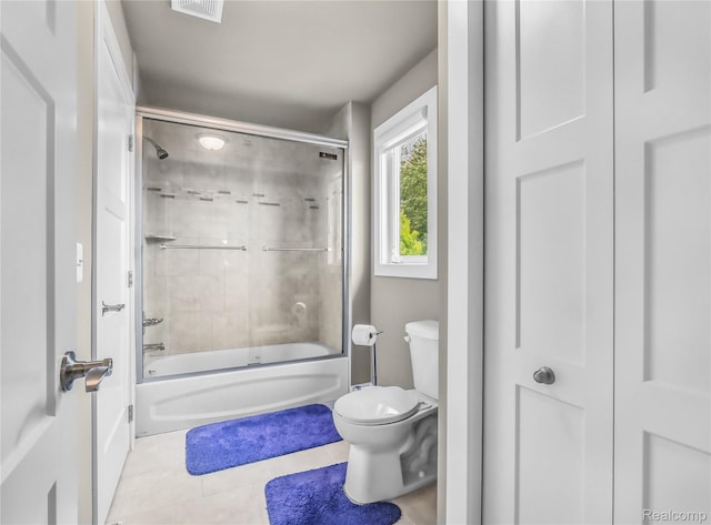 50011 Anita Way N, Macomb, MI 48044 - full bathroom featuring toilet, tile patterned floors, and enclosed tub / shower combo