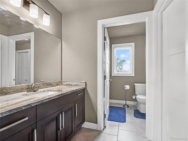 50011 Anita Way N, Macomb, MI 48044 - bathroom with toilet, vanity, baseboards, and tile patterned flooring