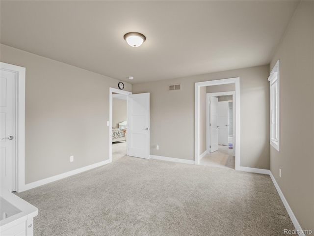 50011 Anita Way N, Macomb, MI 48044 - unfurnished bedroom featuring light colored carpet and baseboards