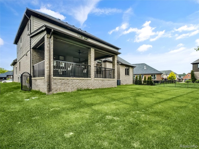 50011 Anita Way N, Macomb, MI 48044 - rear view of property featuring brick siding and a ceiling fan