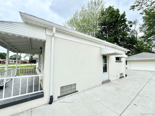 8511 Allen Rd, Allen Park, MI 48101 - view of property exterior with stucco siding and a garage