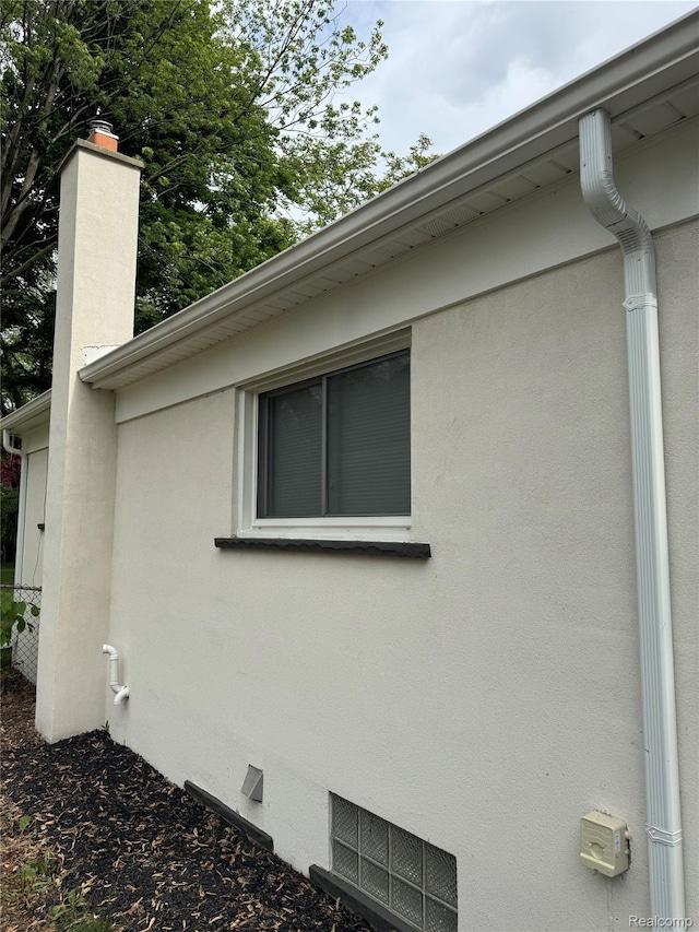 8511 Allen Rd, Allen Park, MI 48101 - view of side of home with stucco siding and a chimney