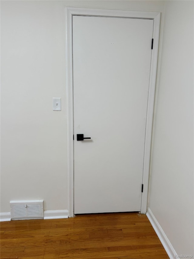 8511 Allen Rd, Allen Park, MI 48101 - doorway featuring wood finished floors and baseboards