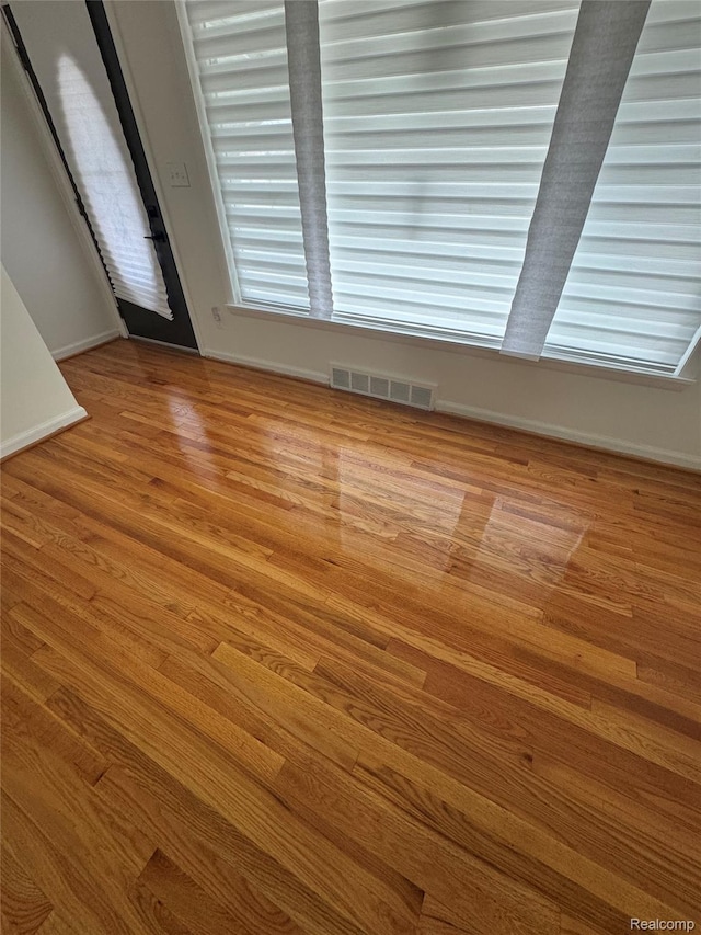 8511 Allen Rd, Allen Park, MI 48101 - empty room with wood finished floors and baseboards