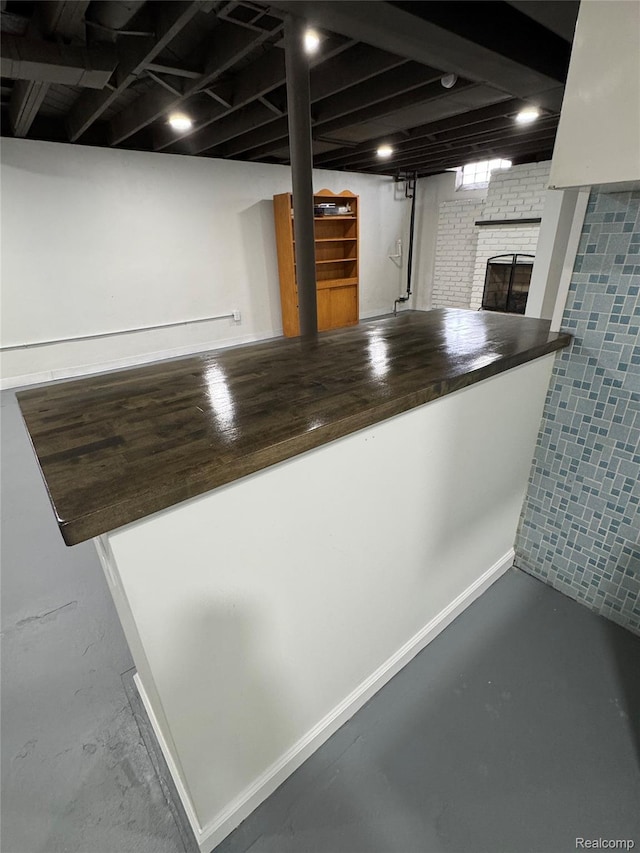8511 Allen Rd, Allen Park, MI 48101 - kitchen view of a brick fireplace and concrete flooring