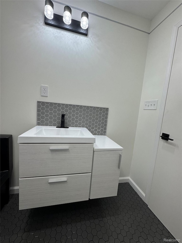 8511 Allen Rd, Allen Park, MI 48101 - bathroom with vanity, tile patterned floors, baseboards, and tasteful backsplash
