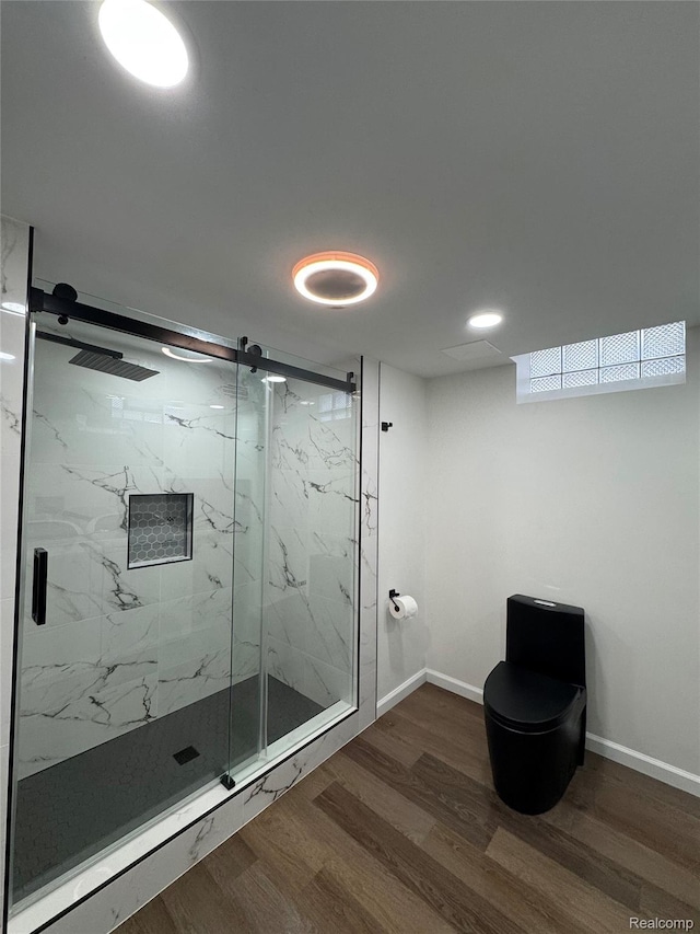 8511 Allen Rd, Allen Park, MI 48101 - bathroom with a marble finish shower, toilet, wood finished floors, and baseboards